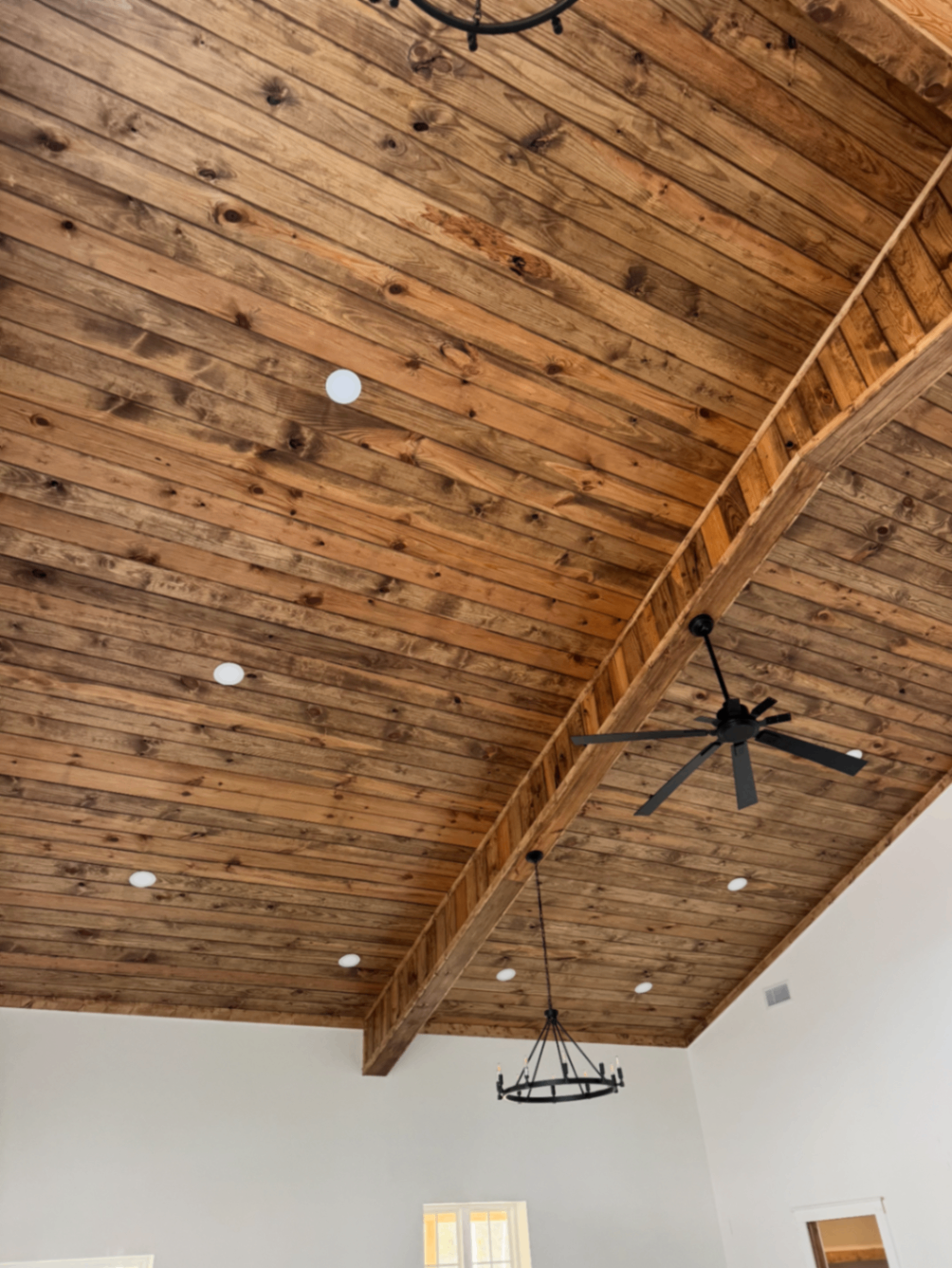 Rustic vaulted wood ceiling with exposed beam detail